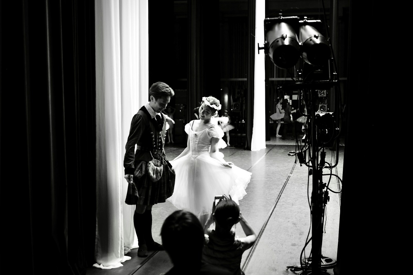 a couple of people that are standing in front of a camera